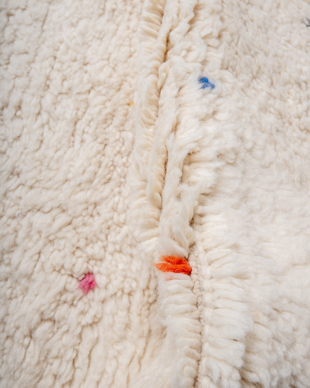 Modern, designer, handcrafted Berber rug from Morocco. Beniourain carpet with beautiful colours and patterns and fluffy wool texture.
